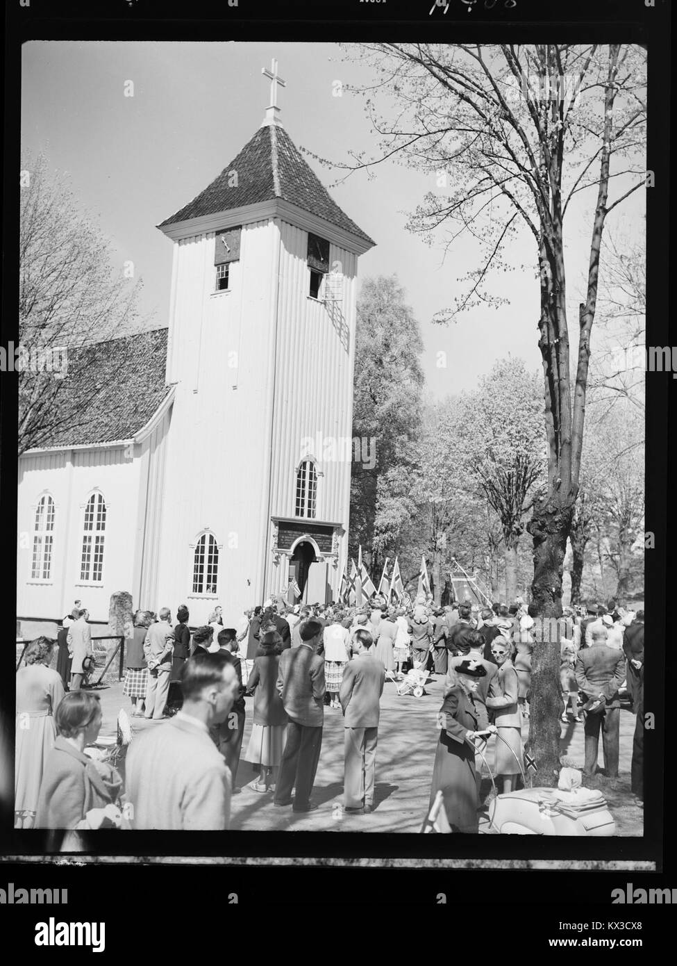 This image depicts Drøbak Kirke on May 17th, showing the church as a significant historical and cultural landmark in Norway. The church is known for its architectural style and its role in the region's religious and cultural heritage. Stock Photo
