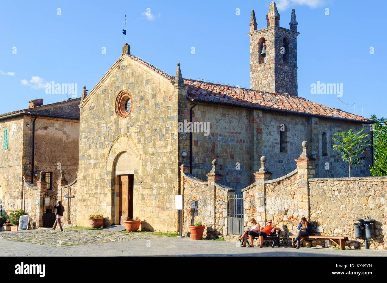 The parish church of Santa Maria Assunta on the pilgrimage to Rome - Monteriggioni, Italy Stock Photo