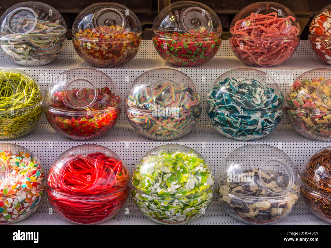 Colorful sweets in plastic ball containers Stock Photo Alamy