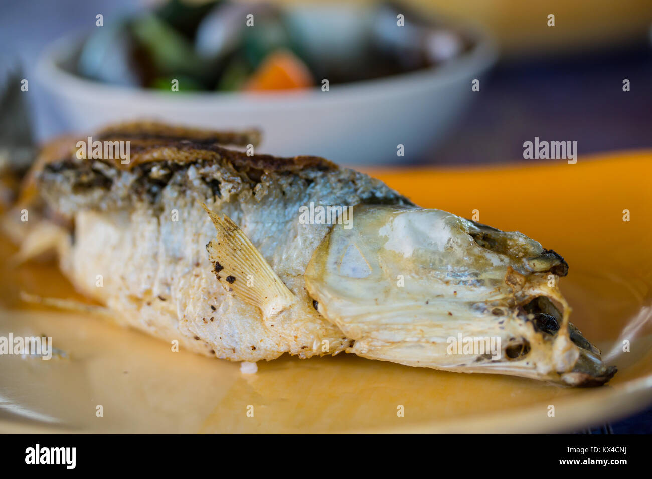 Deep fried whole Bangus cooked Filipino style,crispy & crunchy Stock