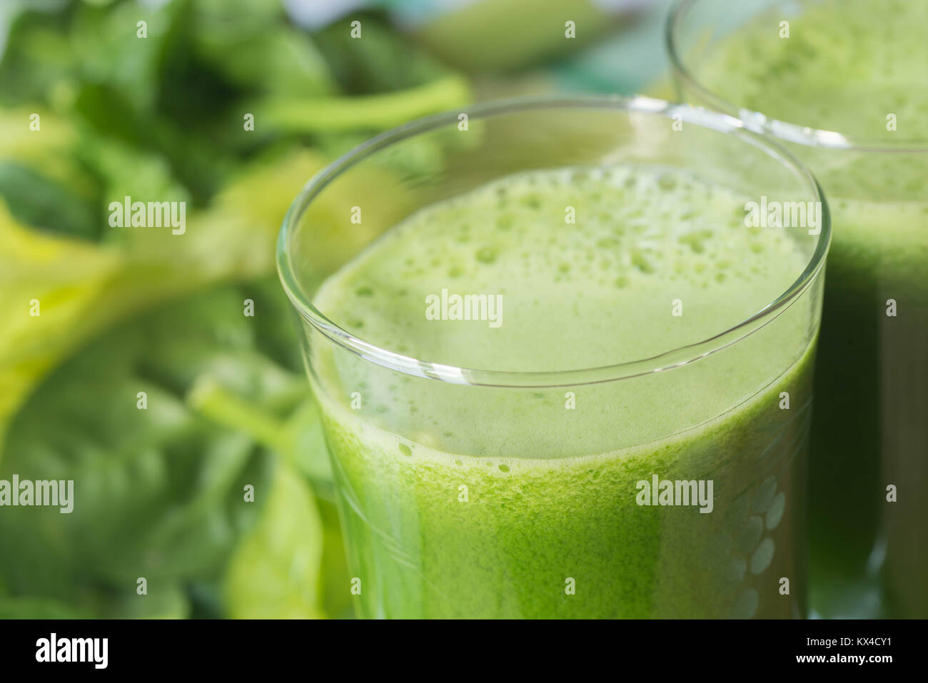 fresh green spinach leaves and  celery juice in glass Stock Photo