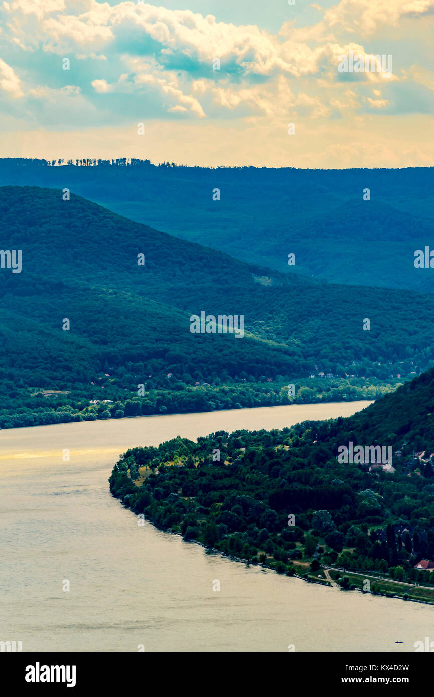 Panoramic landscape of river and mountains, high angle. Scenic view of Danube Bend and Pilis Mountains, Visegrád, Hungary. Stock Photo