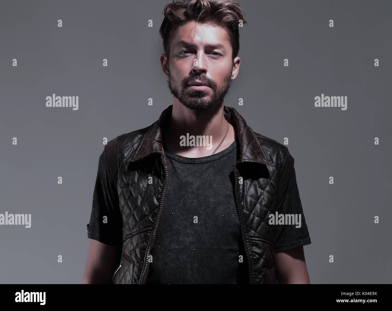 Portrait of a pensive handsome man over gray background Stock Photo - Alamy