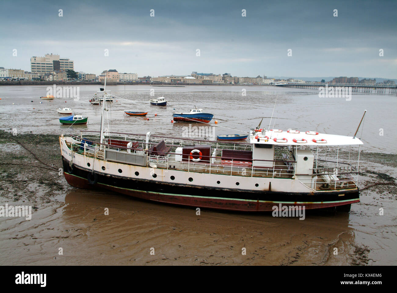 Weston-Super-Mare, Somerset, UK, showing amusement arcade and boats on the beach at low tide. Stock Photo