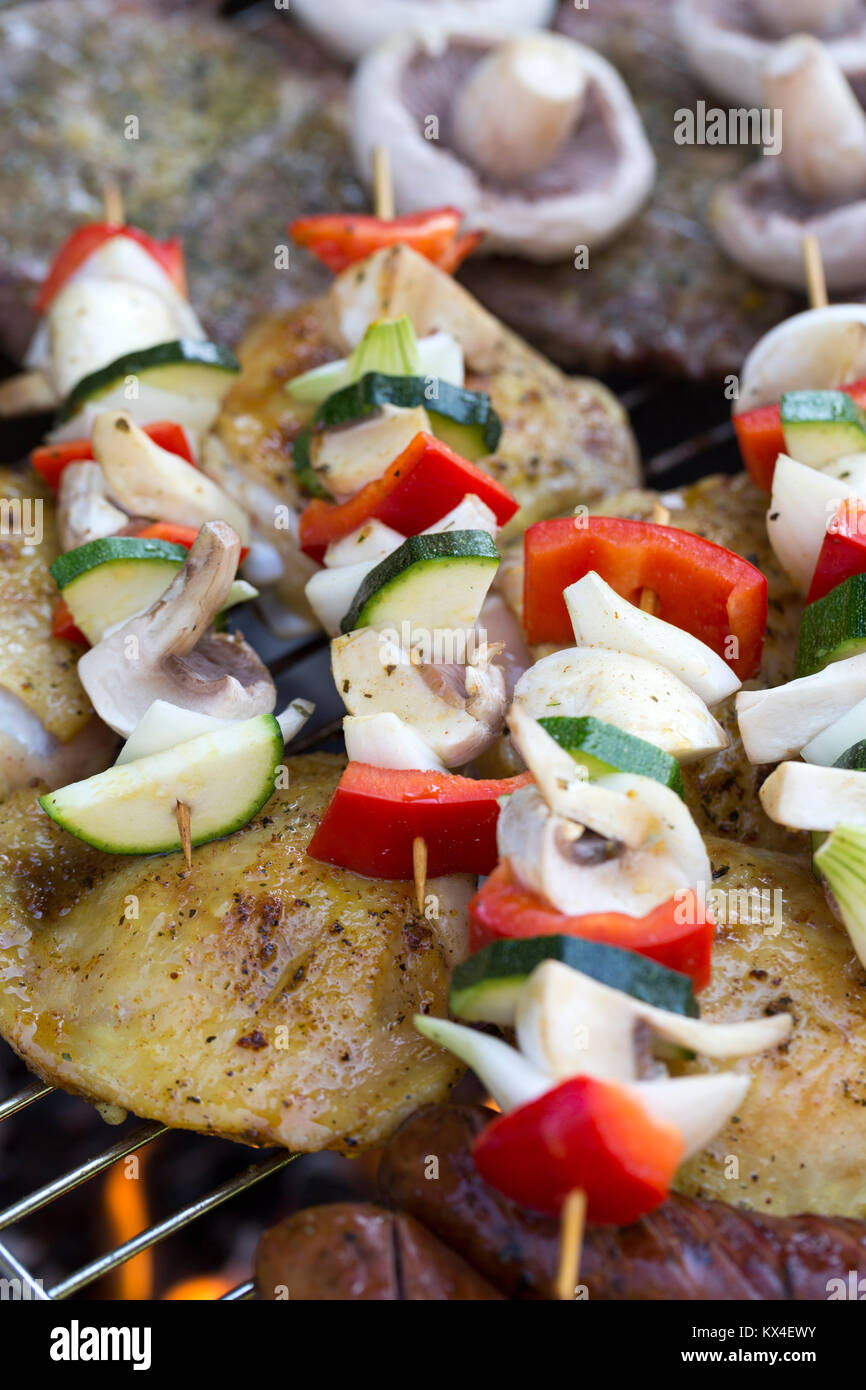 barbecue with delicious grilled meat and vegetables on grill Stock ...