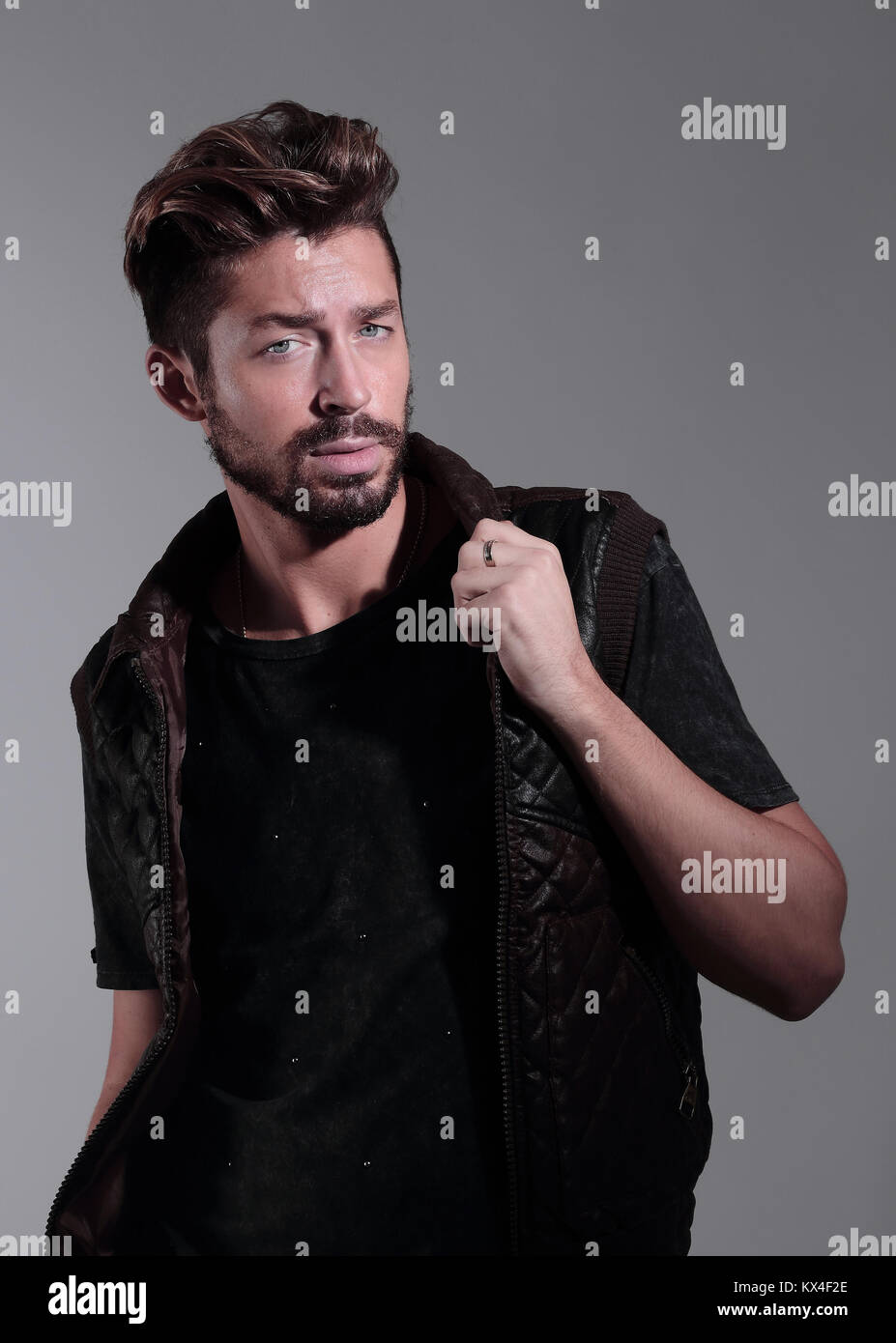 Portrait of a pensive handsome man over gray background Stock Photo - Alamy