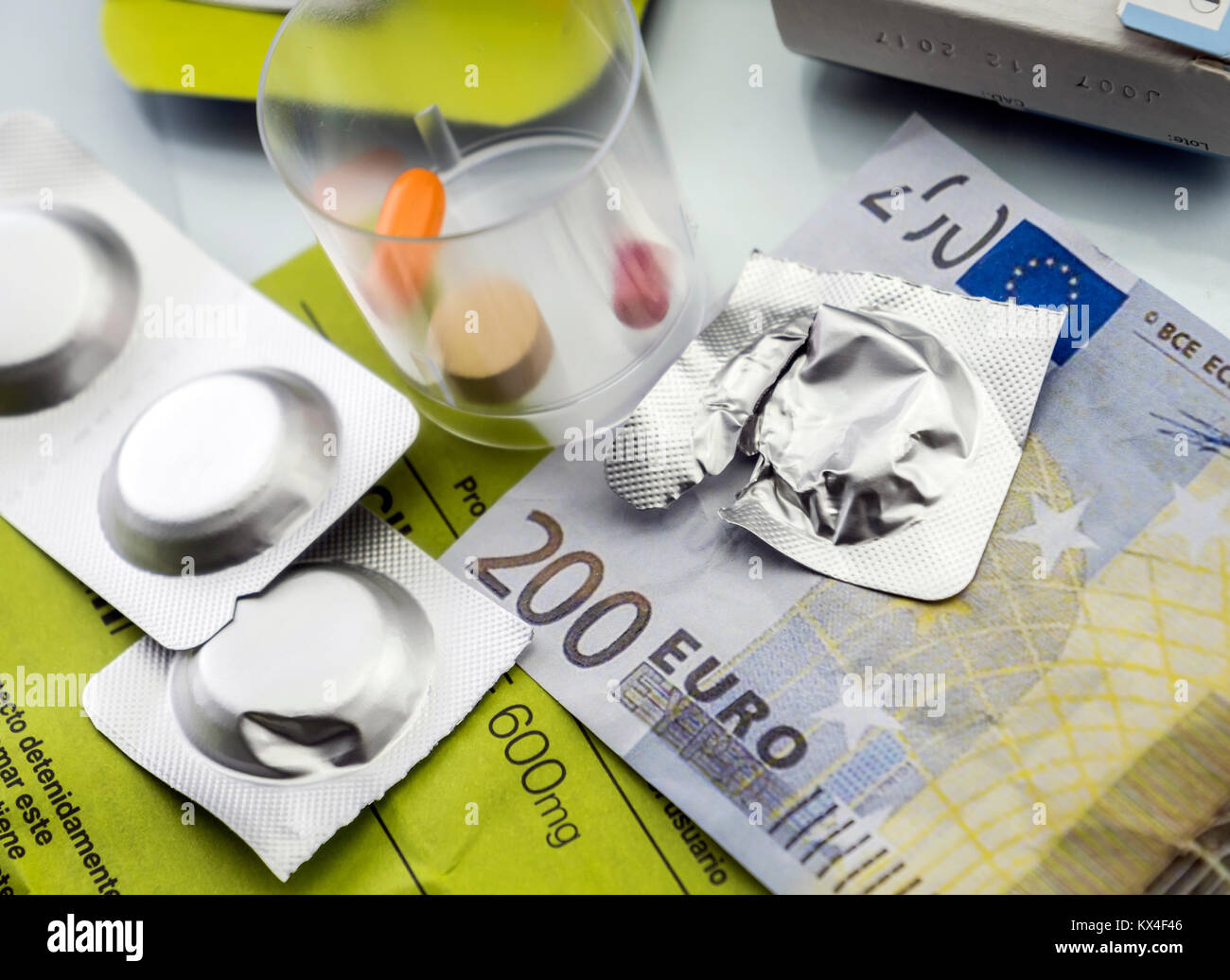 Pastilla effervescent next to medication daily on a ticket of 200 euros, concept of copayment health Stock Photo