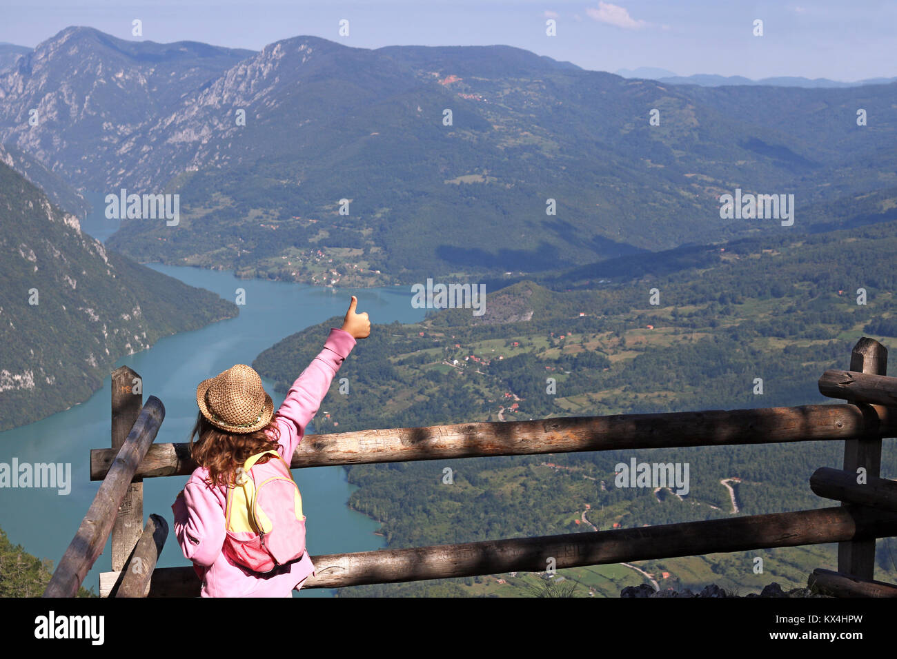 little girl hiker with thumbs up on mountain viewpoint Stock Photo - Alamy