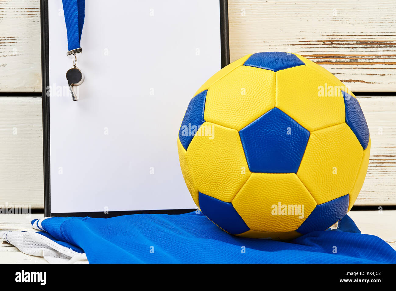 Soccer ball, clipboard, whistle, uniform Stock Photo