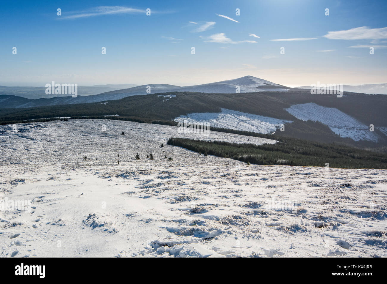 View of Snow-Covered Wicklow Uplands on Sunny Winter Day in Ireland Stock Photo