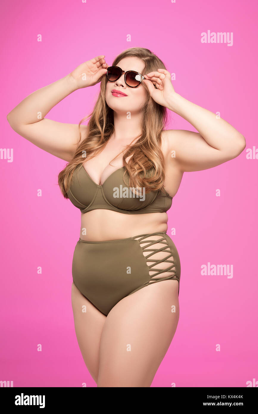 overweight woman in swimsuit and sunglasses Stock Photo - Alamy