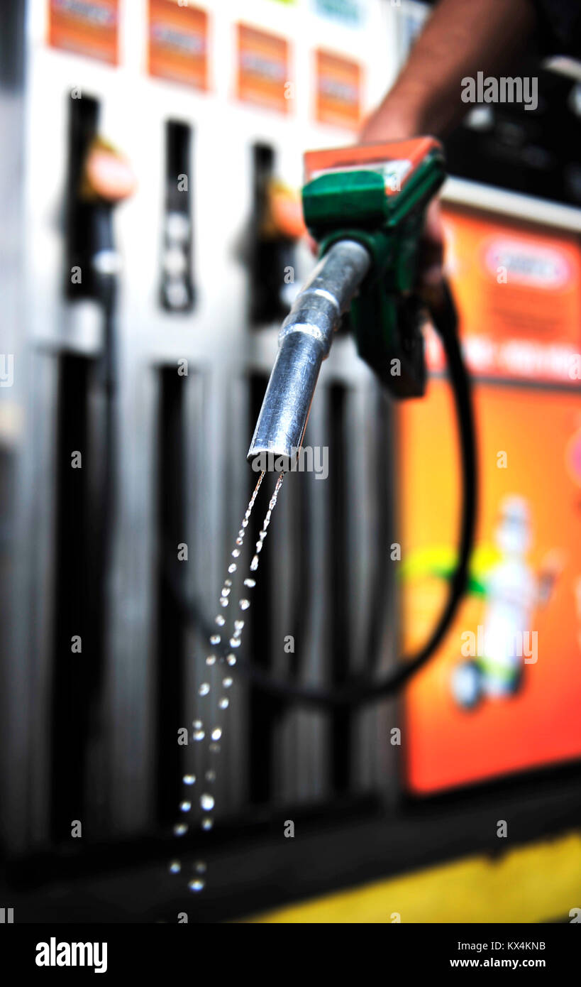 Man holding gasoline pistol Stock Photo Alamy