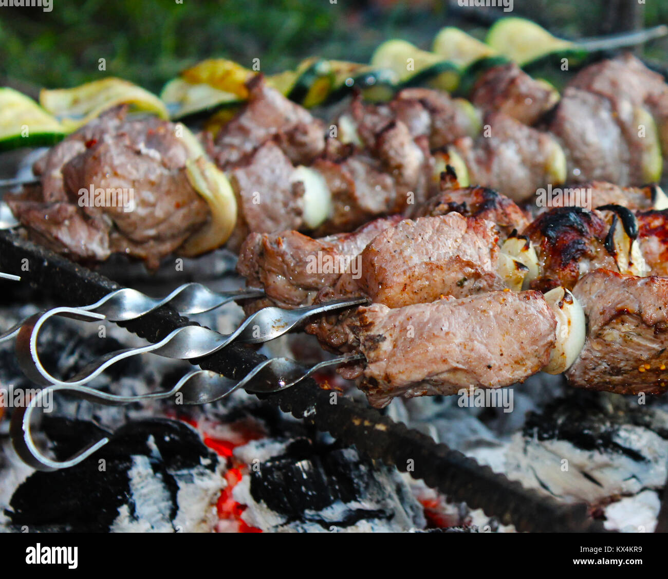 shish kebab on skewers on fire close-up Stock Photo