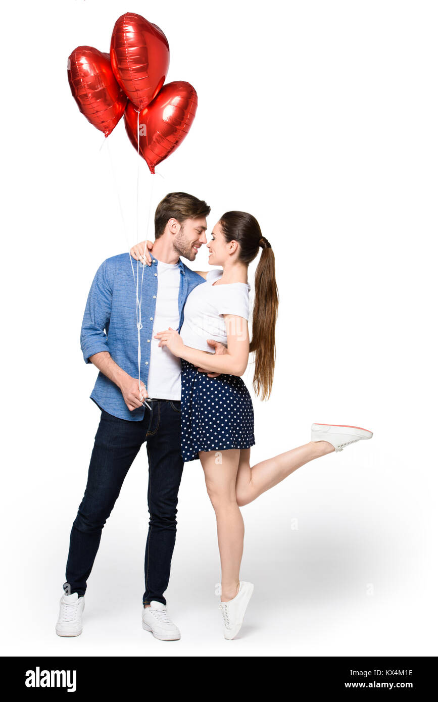 couple with heart shaped balloons Stock Photo - Alamy