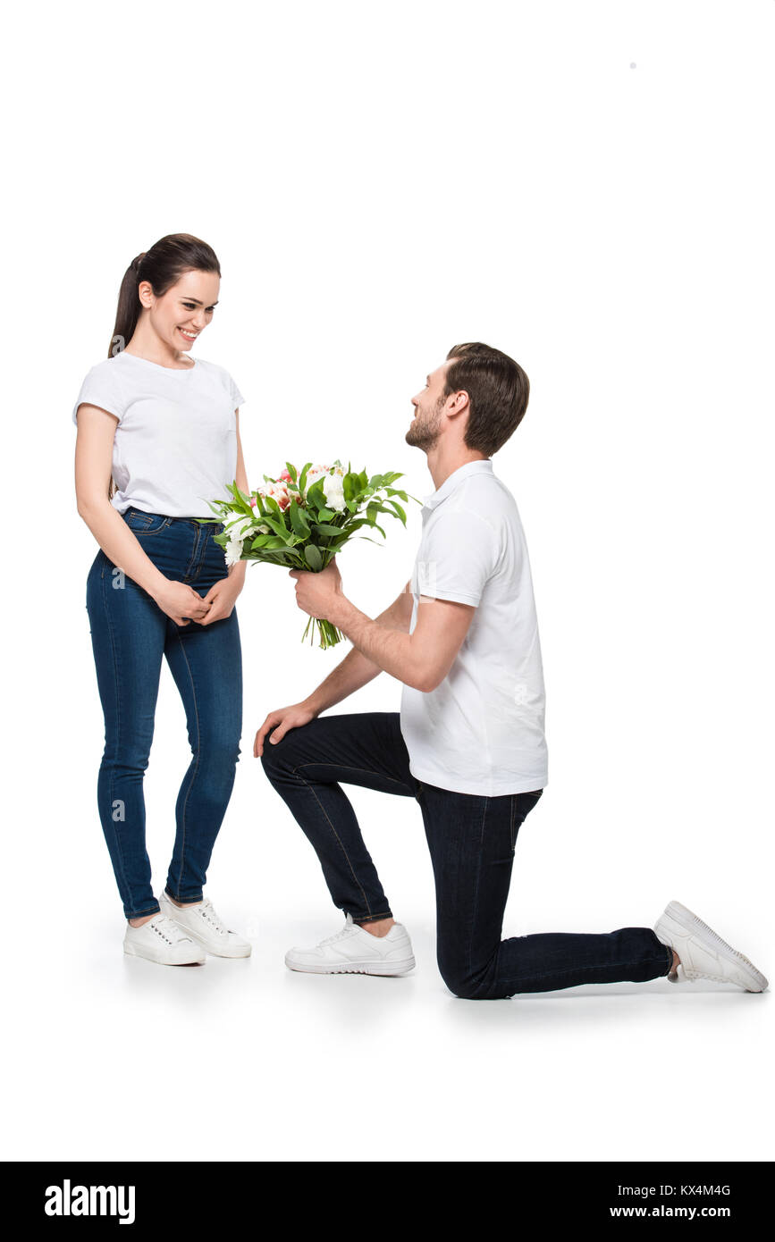 Happy couple present flowers hi-res stock photography and images - Alamy