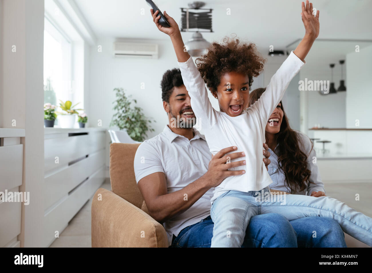 Young family being playful at home Stock Photo