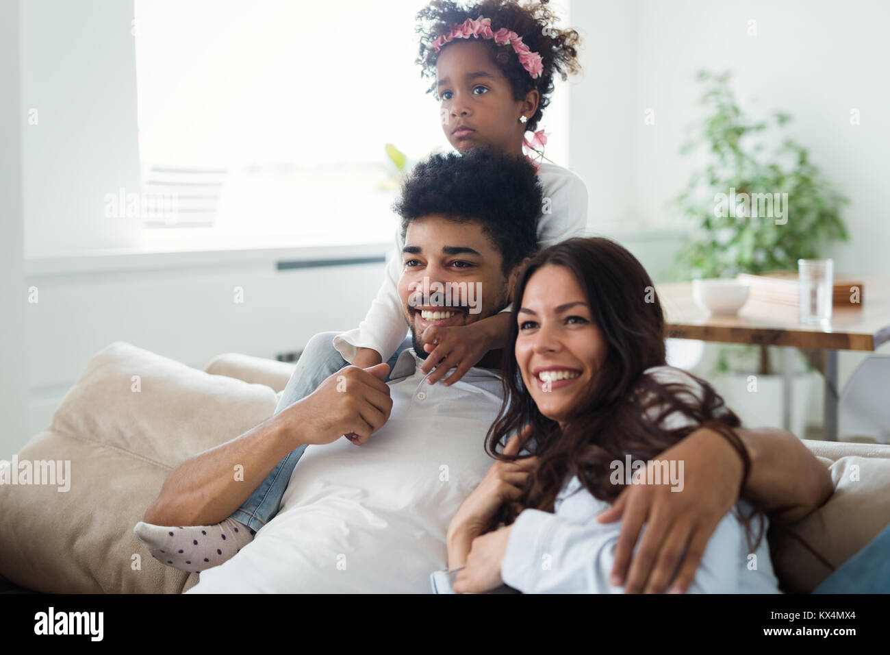 Happy young family relax and have fun at home Stock Photo