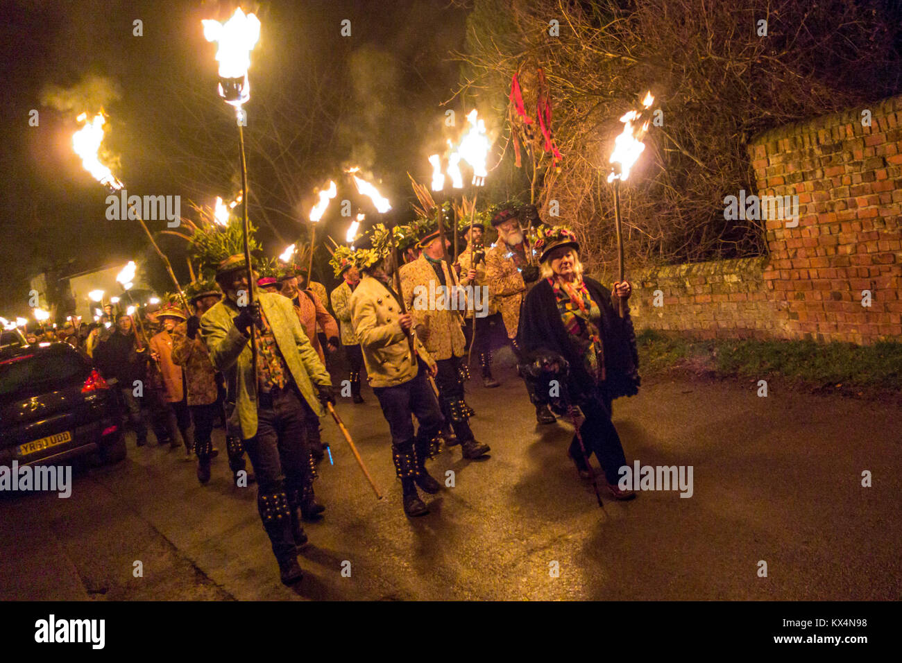 Dilwyn, Herefordshre, UK. 6th Jan, 2018. Members of the Leominster Morris seen walking through the street with crowds at the Crown Inn before heading to the apple orchard of Mr Richard Wellings to take part in a torchlit Cider wassailing ceremony ahead of Twelfth Night. Credit: ZUMA Press, Inc./Alamy Live News Stock Photo