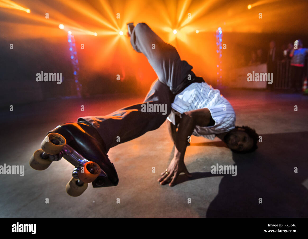 Mainz, Germany. 6th Jan, 2017. A man performs breakdance moves on roller  skates in Mainz, Germany, 6 January 2017. A roller disco with more than  1,500 participants is held at "Halle 45"