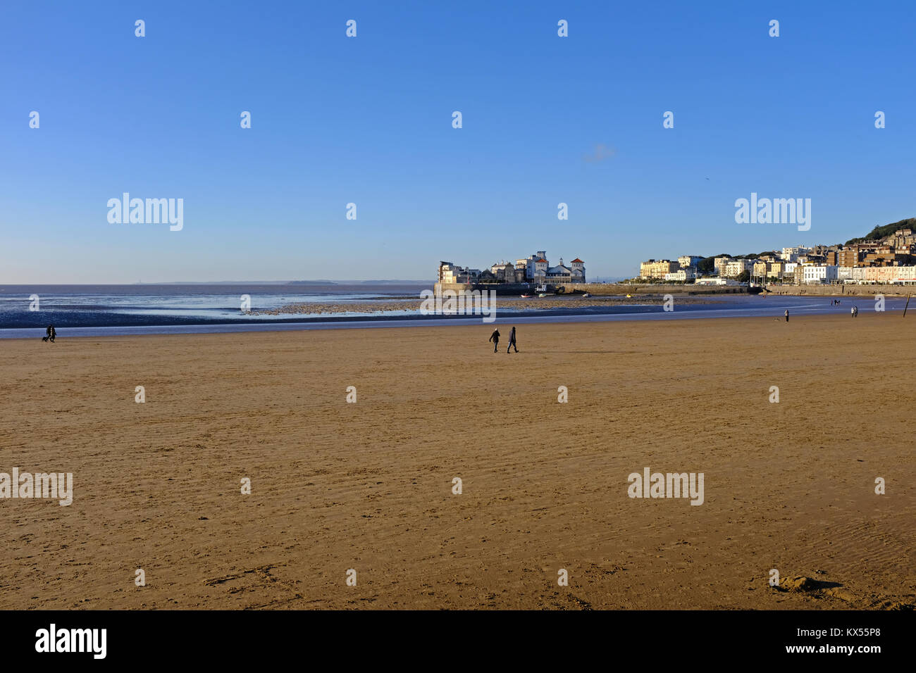 Weston-super-Mare, UK. 7th January, 2018. UK weather: walkers enjoy a sunny Sunday afternoon despite a cold north-easterly wind. Keith Ramsey/Alamy Live News Stock Photo