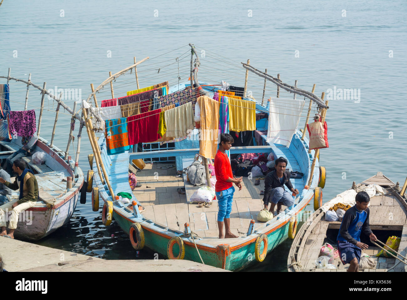 Varanasi, Uttar Pradesh, India, 22th of january 2017, Dry cleaner's inside a boat on the Ganges river Stock Photo