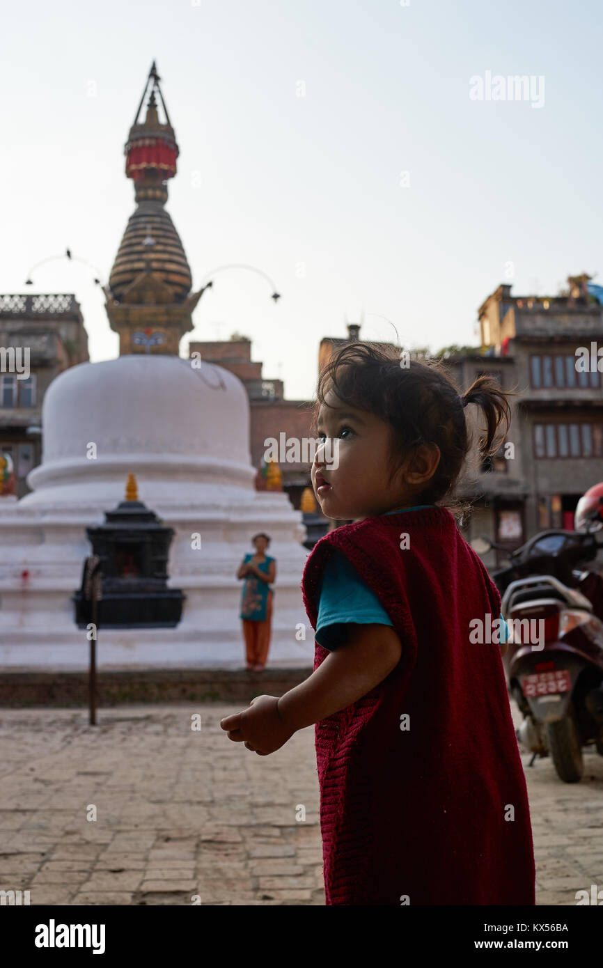 Nepali baby in front of a stupa, Kathmandu, Nepal Stock Photo