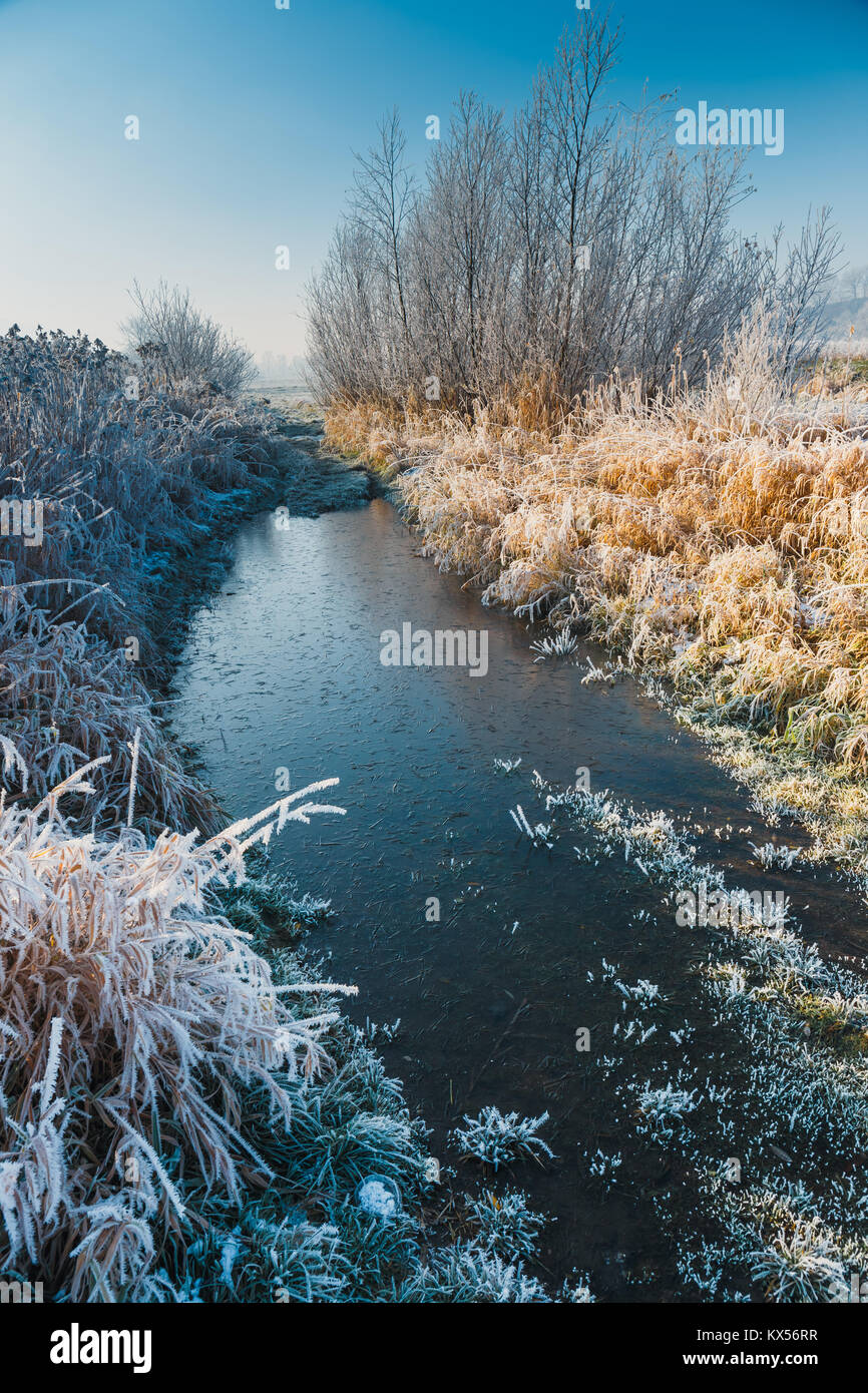 winter landscape with a river and trees covered with hoarfrost Stock ...
