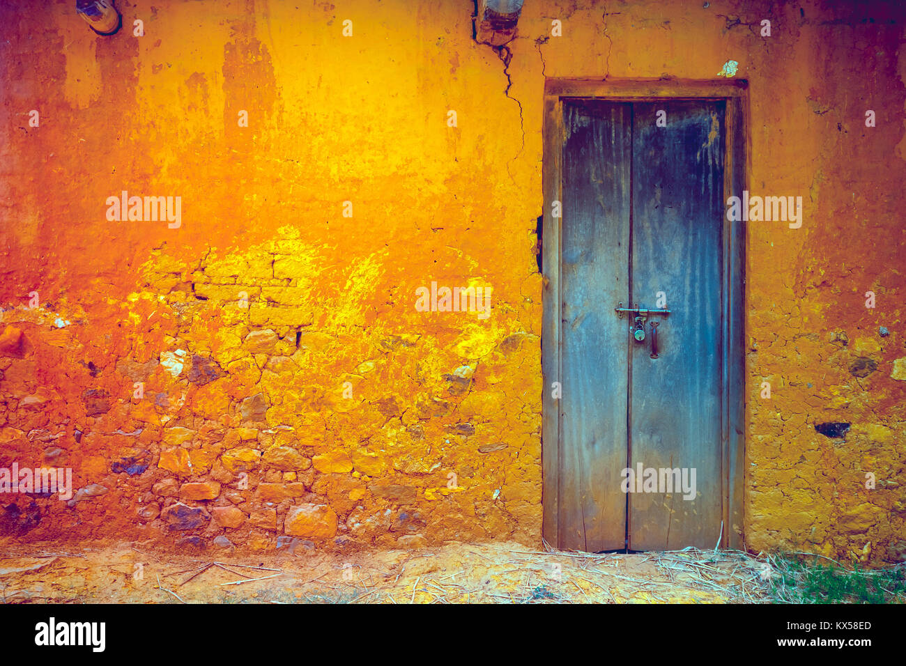 Stylish cracked vintage colorful wall in yellow orange shades with ...