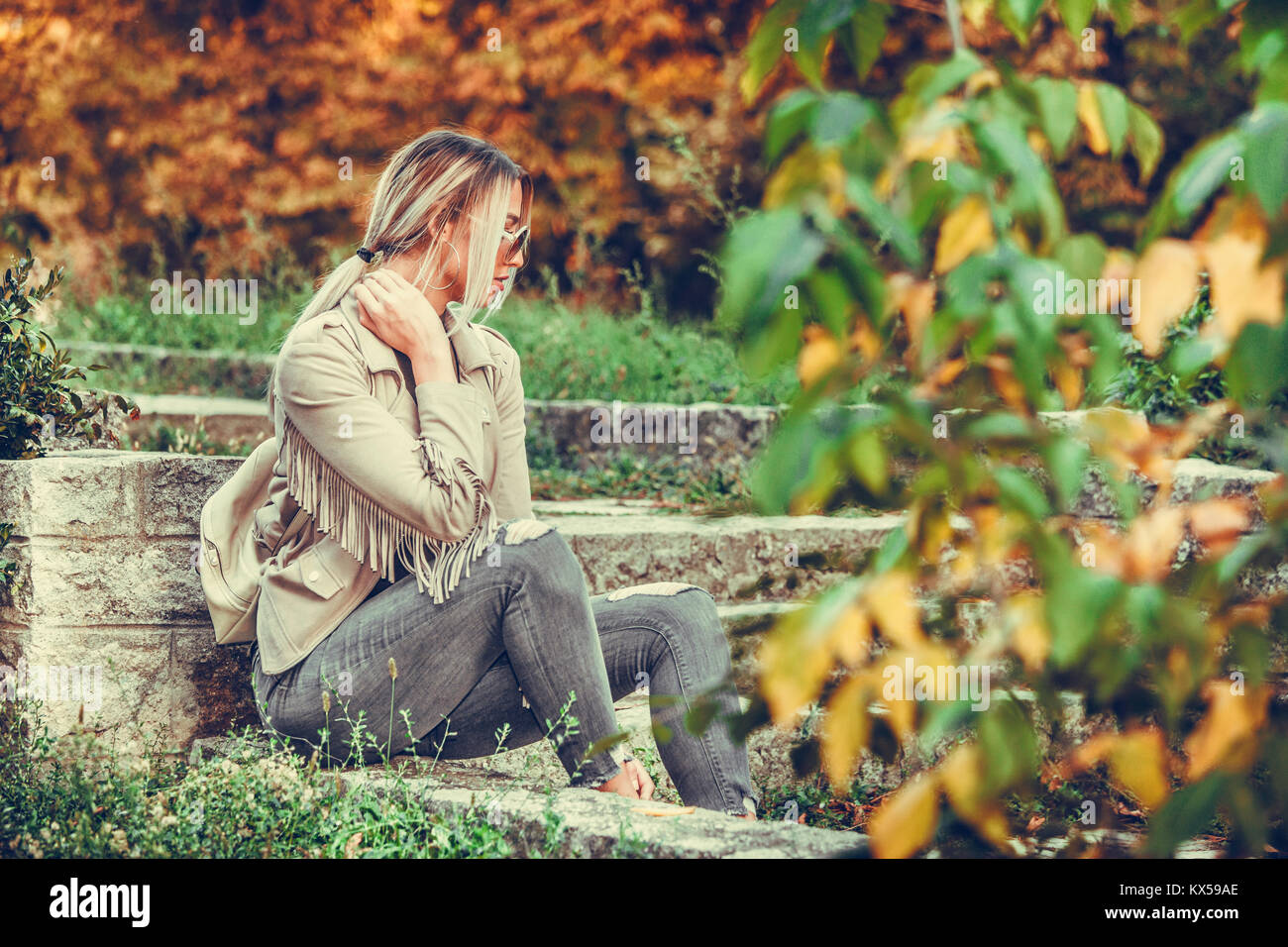 Portrait of a beautiful young modern and urban woman with sunglasses ...
