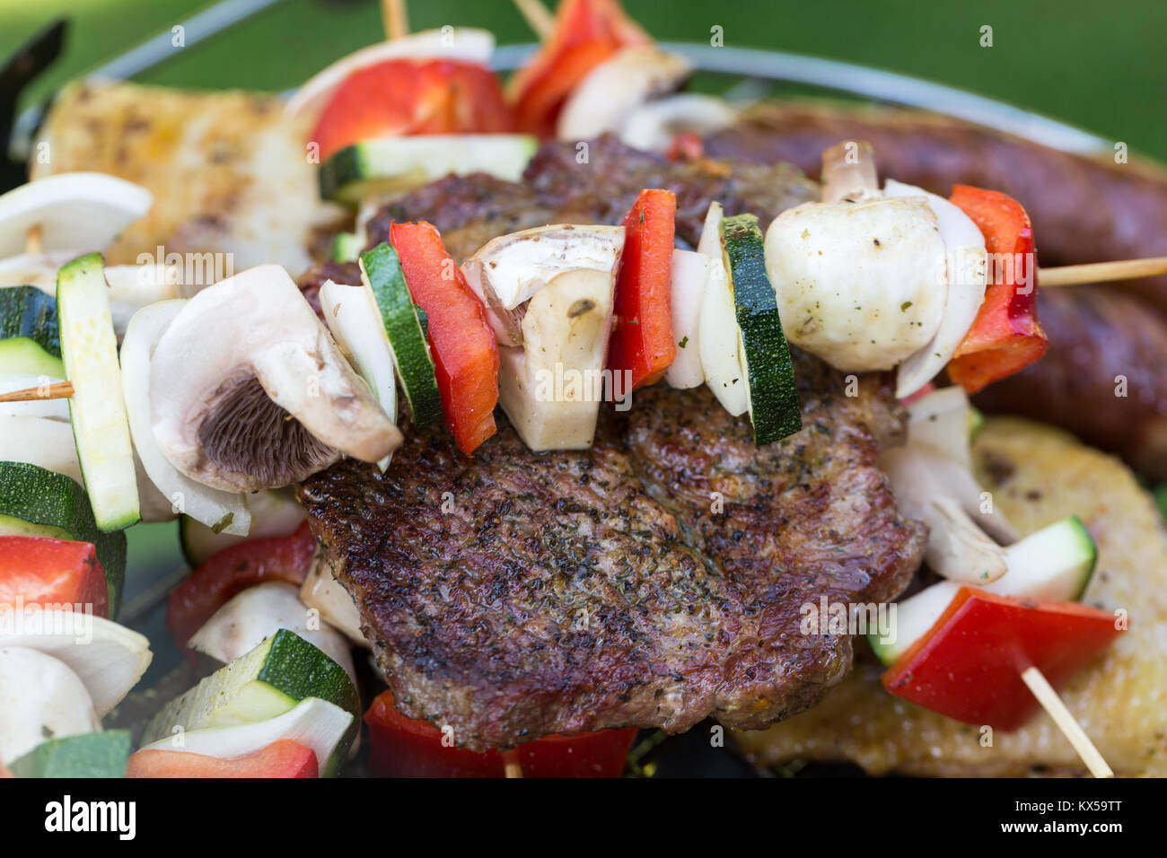 barbecue with delicious grilled meat and vegetables on grill Stock ...