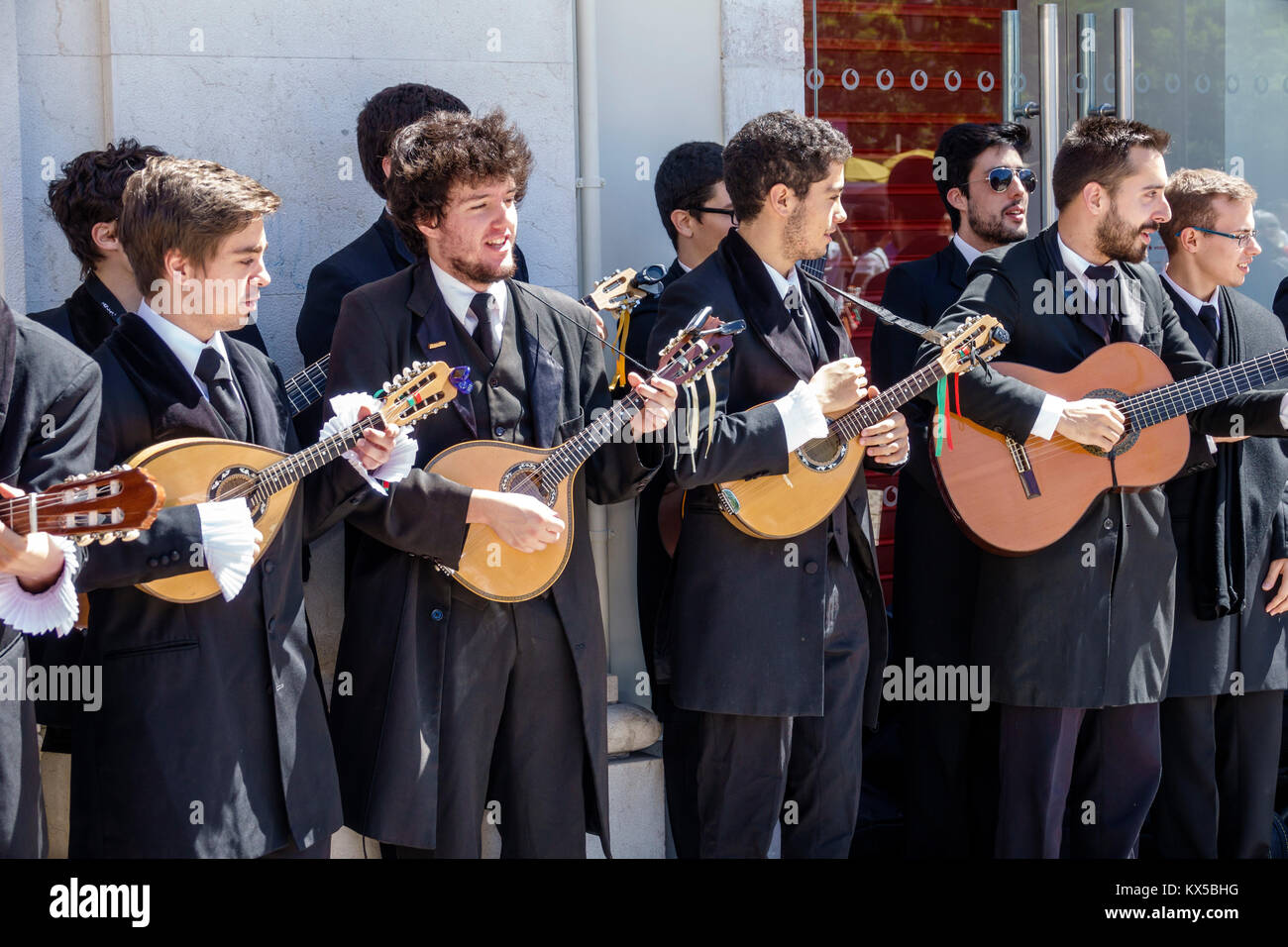 Lisbon Portugal,historic center,Rossio Square,Praca Rossio,Tuna,traditional music group,student students education pupil youth,musicians,adult adults Stock Photo