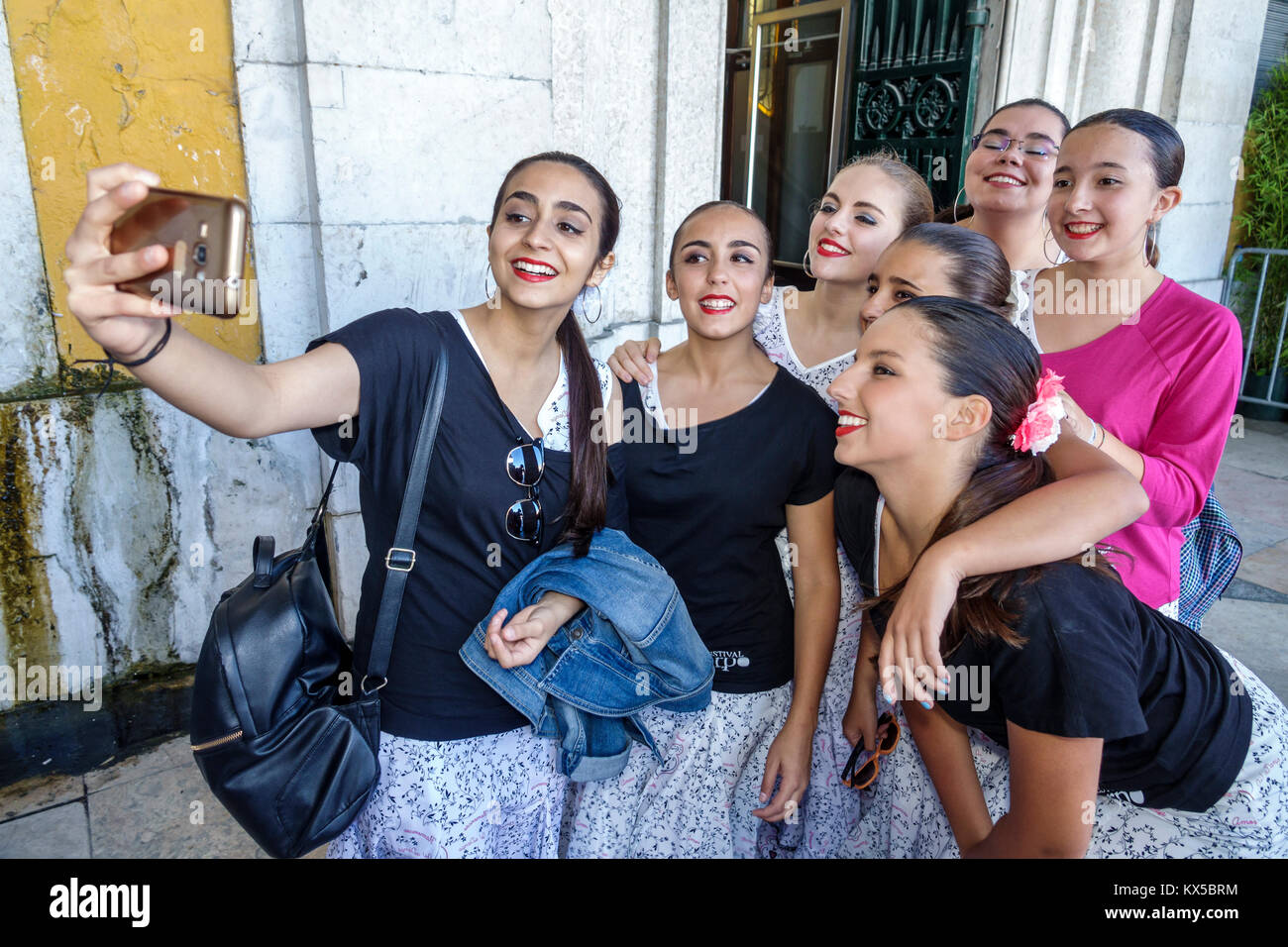 Lisbon Portugal,Baixa,Chiado,historic center,Praca do Comercio,Commerce Square,public plaza,Festas de Lisboa,festival,performers,dance group,girl girl Stock Photo