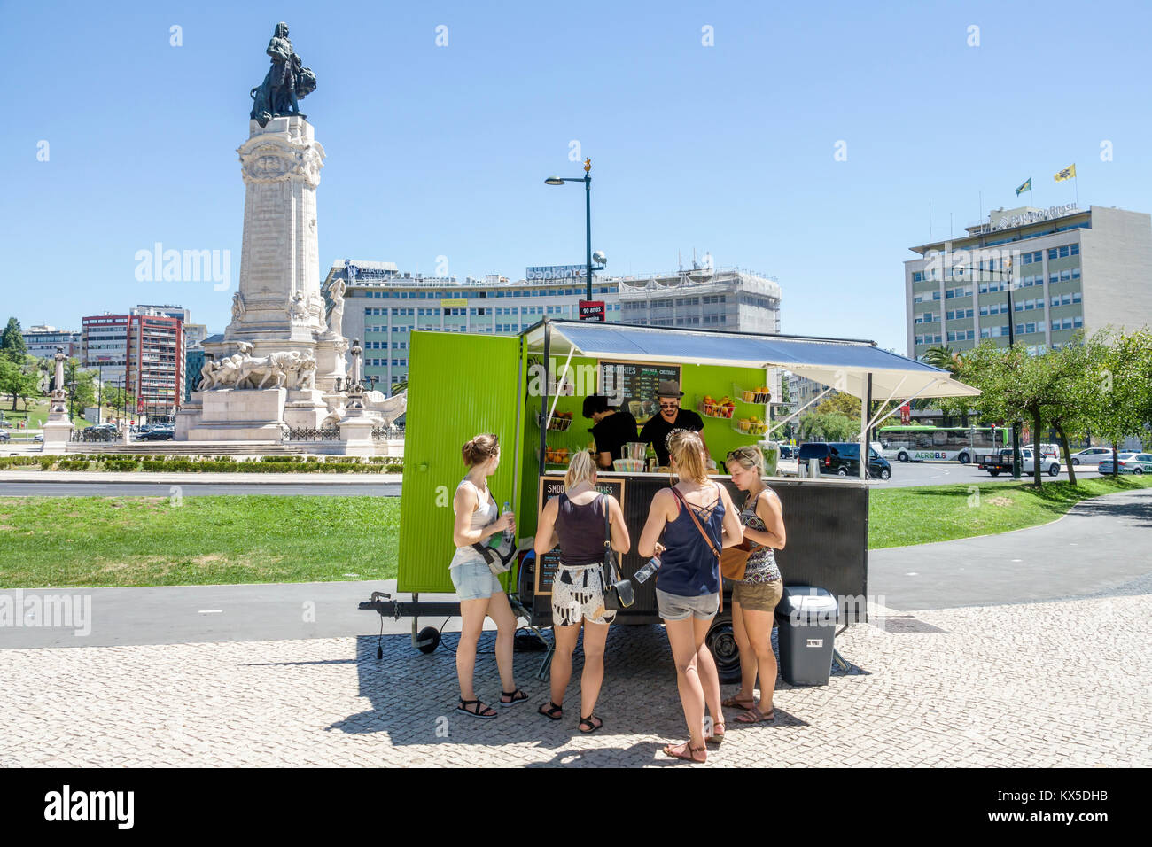 Lisbon Portugal,Praca do Marques de Pombal,roundabout,street food,vendor vendors sell selling,stall stalls booth market vending trailer,woman female w Stock Photo