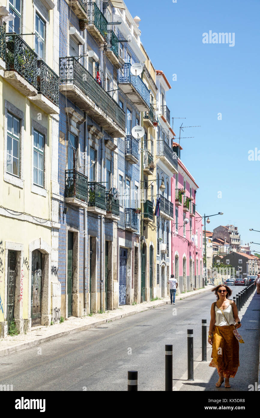 Lisbon Portugal,Alfama,street,historic center,buildings,woman female women,walking,Hispanic,immigrant immigrants,Portuguese,PT170703022 Stock Photo