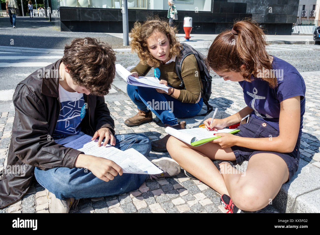 Porto Portugal,Praca Bom Sucesso,plaza,Hispanic boy boys,male kid kids child children,girl girls,female,teen teens teenager teenagers,student students Stock Photo