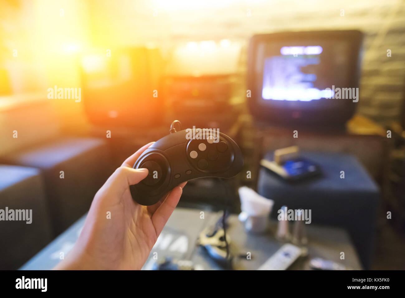 Gamer using controller to play online video games on computer. Man playing  game with joystick and headphones in front of monitor. Player having gaming  equipment, doing fun activity Stock Photo - Alamy