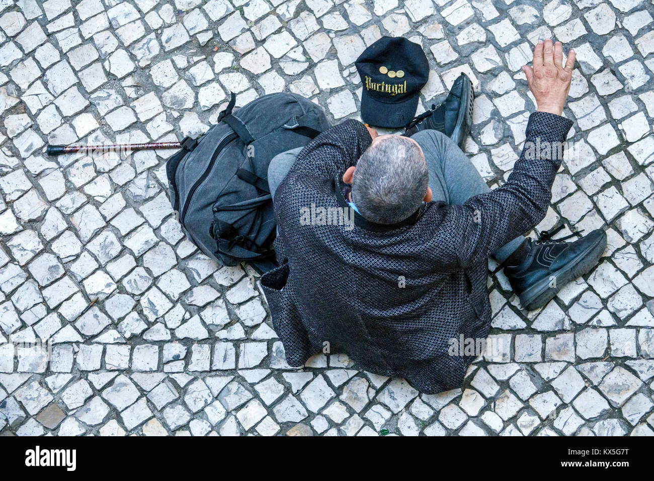 Lisbon Portugal,historic center,Praca dos Restauradores,plaza,Hispanic,immigrant immigrants,man men male,senior seniors citizen citizens,walking cane, Stock Photo