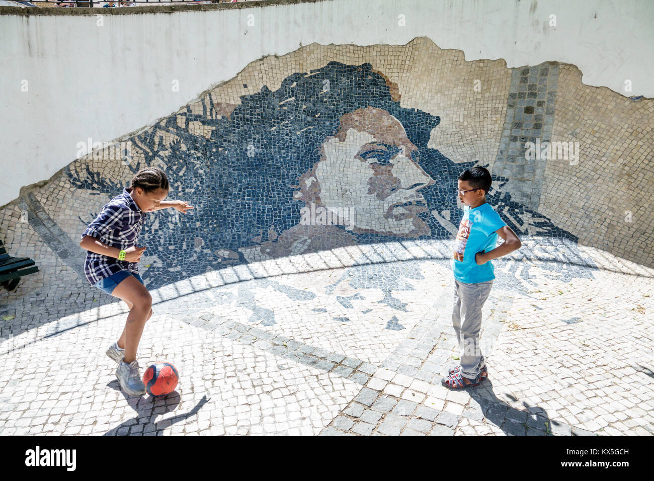 Lisbon Portugal,Alfama,historic neighborhood,Wall Of Amalia Rodrigues,tile mural,singer,fado,Black minorities,mixed race,girl girls,female kid kids ch Stock Photo