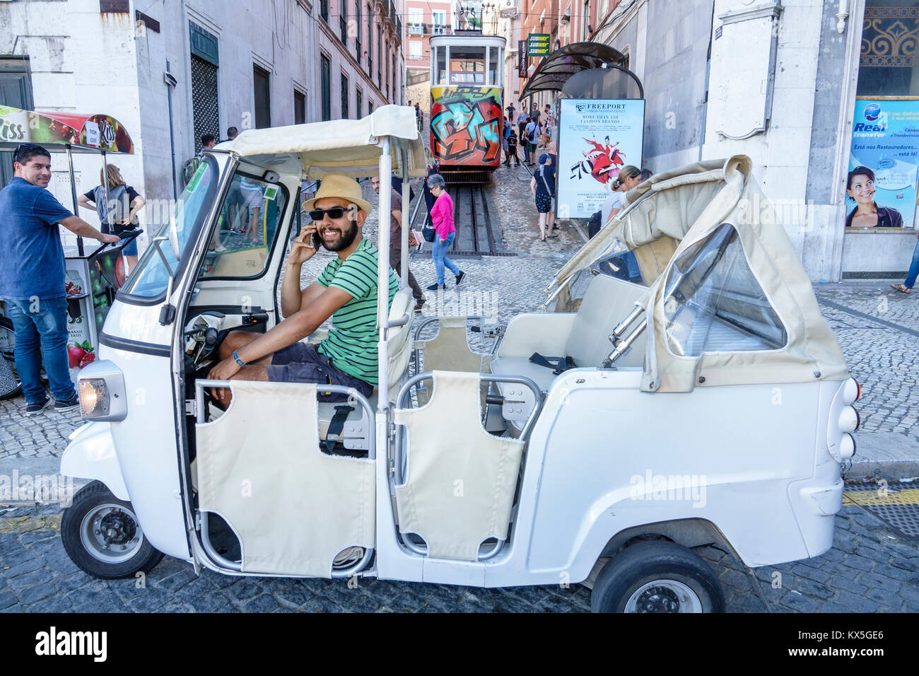 Lisbon Portugal,Pombaline downtown,Restauradores Square,auto rickshaw,three-wheeler,tuk-tuk,Hispanic,immigrant immigrants,man men male,driver,Hispanic Stock Photo