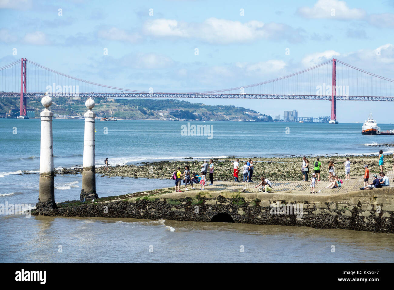 Lisbon Portugal,Tagus River,Praca do Comercio,Commerce Square,Cais das Colunas,waterfront,city entrance gate,columns,view,Ponte 25 de Abril,April 25 s Stock Photo