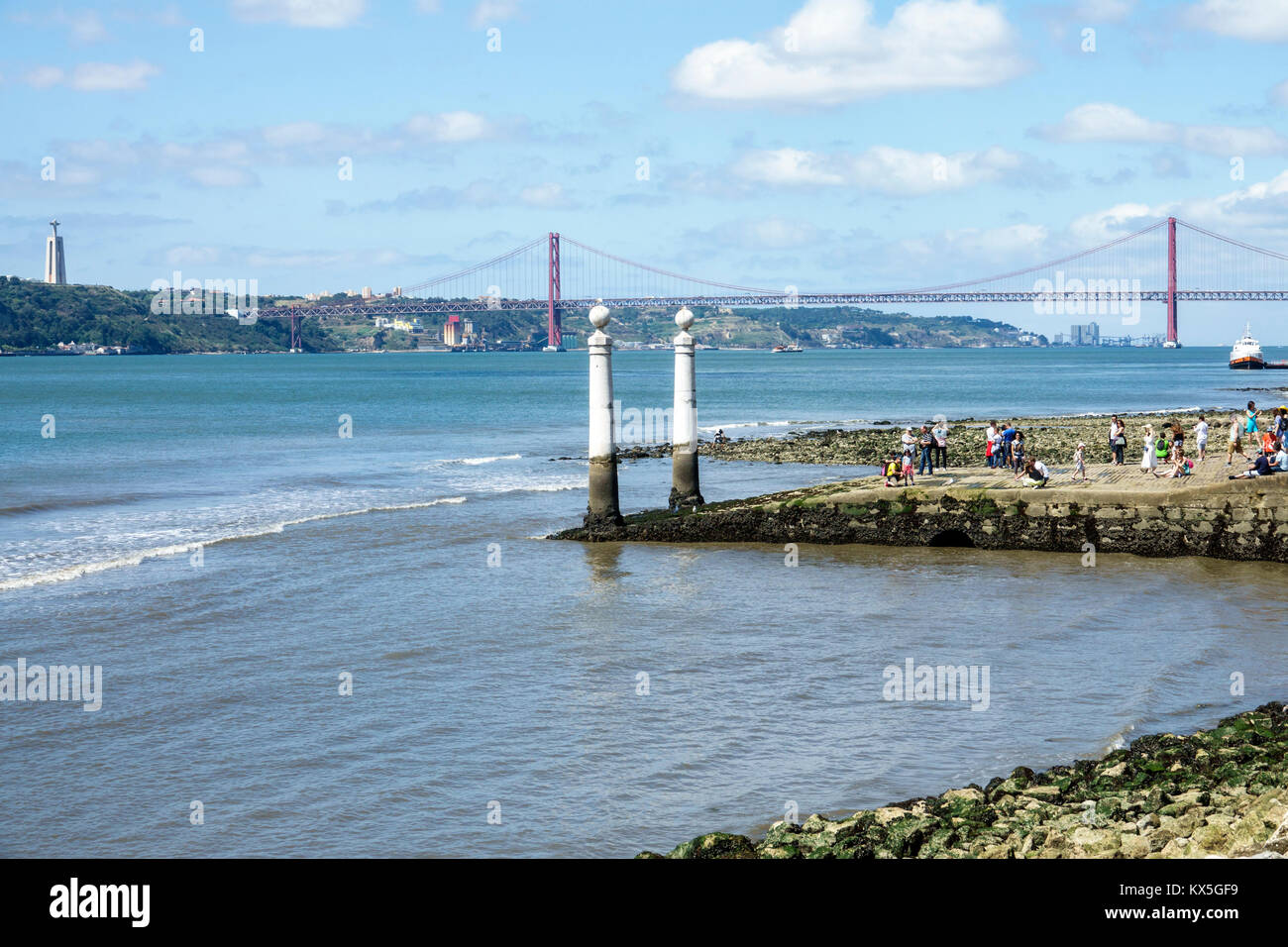 Lisbon Portugal,Tagus River,Praca do Comercio,Commerce Square,Cais das Colunas,waterfront,city entrance gate,columns,view,Ponte 25 de Abril,April 25 s Stock Photo