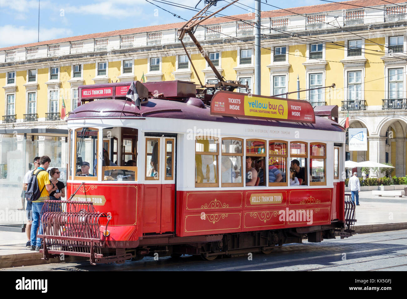 Lisbon Portugal,Praca do Comercio,Terreiro do Paco,plaza,Commerce Square,heritage tram,trolley,Hispanic,immigrant immigrants,riders,man men male,woman Stock Photo