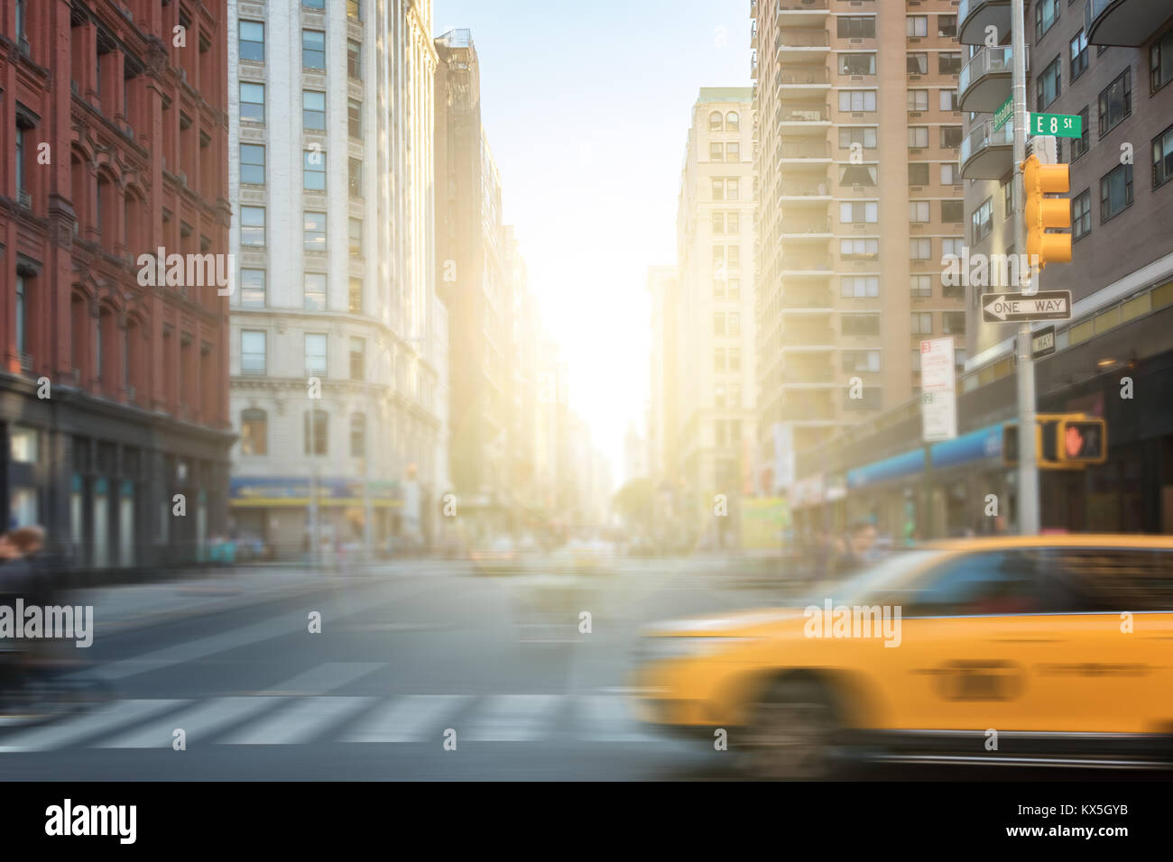 New York City street scene with yellow taxi cab and people crossing ...