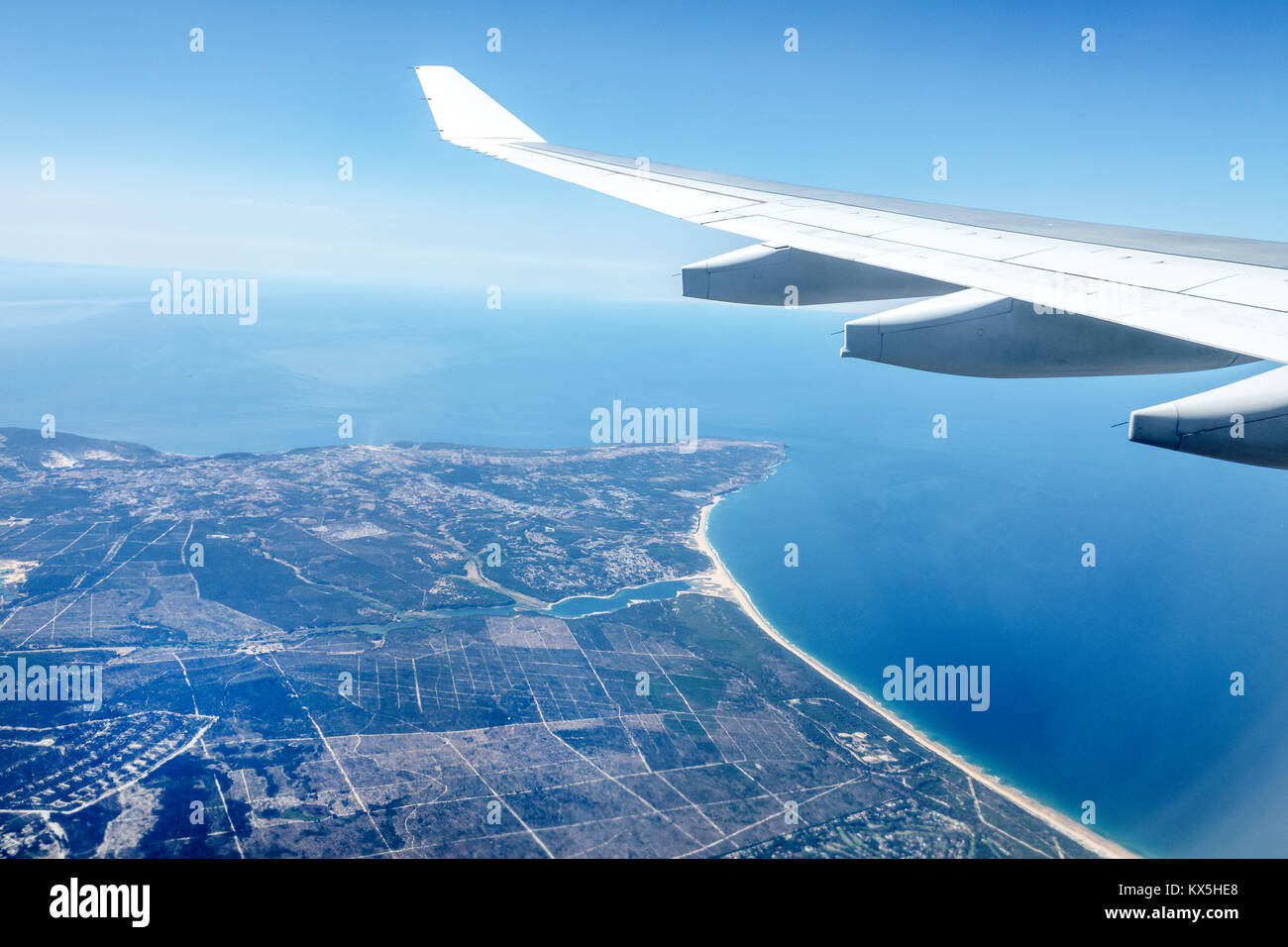 Lisbon Portugal,TAP,Air Portugal,airline,aircraft,wing,view,coastline,Atlantic Ocean,Lagoa de Albufeira,Castelo,Hispanic,immigrant immigrants,Portugue Stock Photo