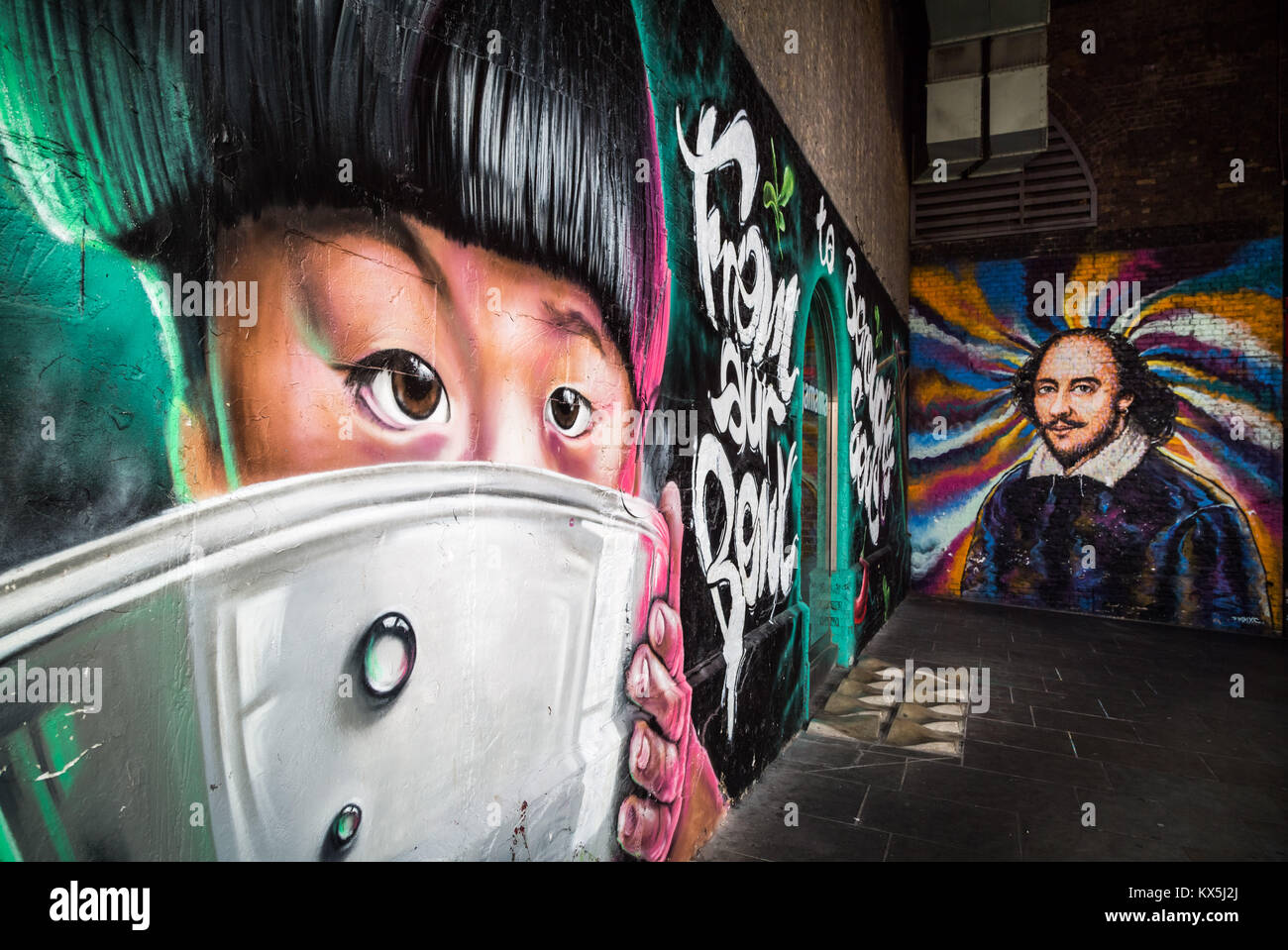 Wagamama restaurant entrance and William Shakespeare mural on a brick wall in Clink Street, Southwark, London. Stock Photo