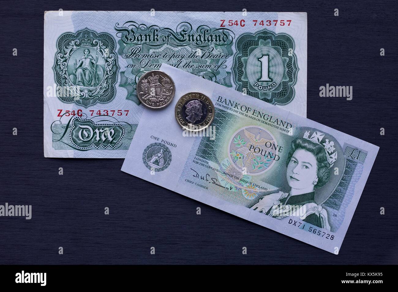 A collection of old bank notes the old round pound coin and the new 12