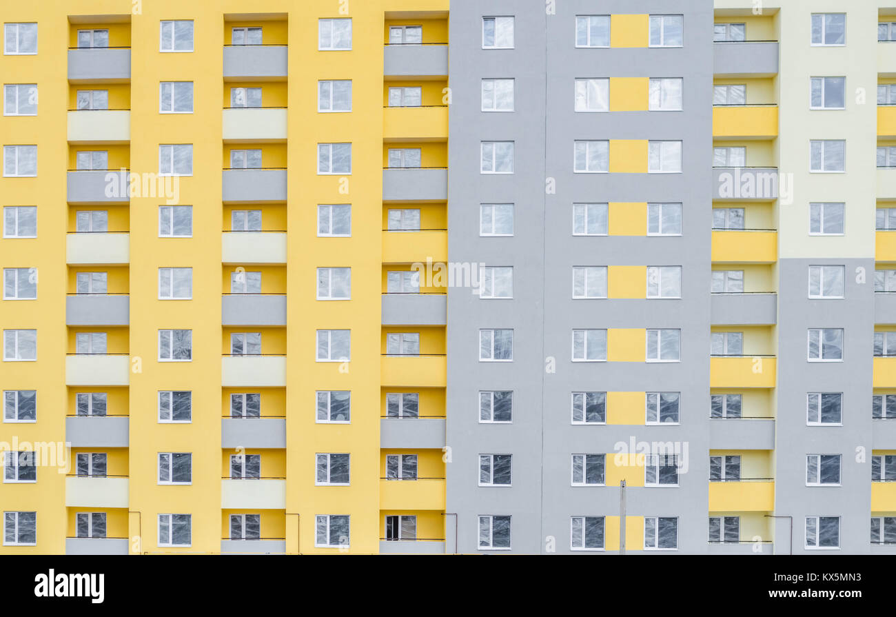 Facade of a multi-storey building. Fragment. Background Stock Photo