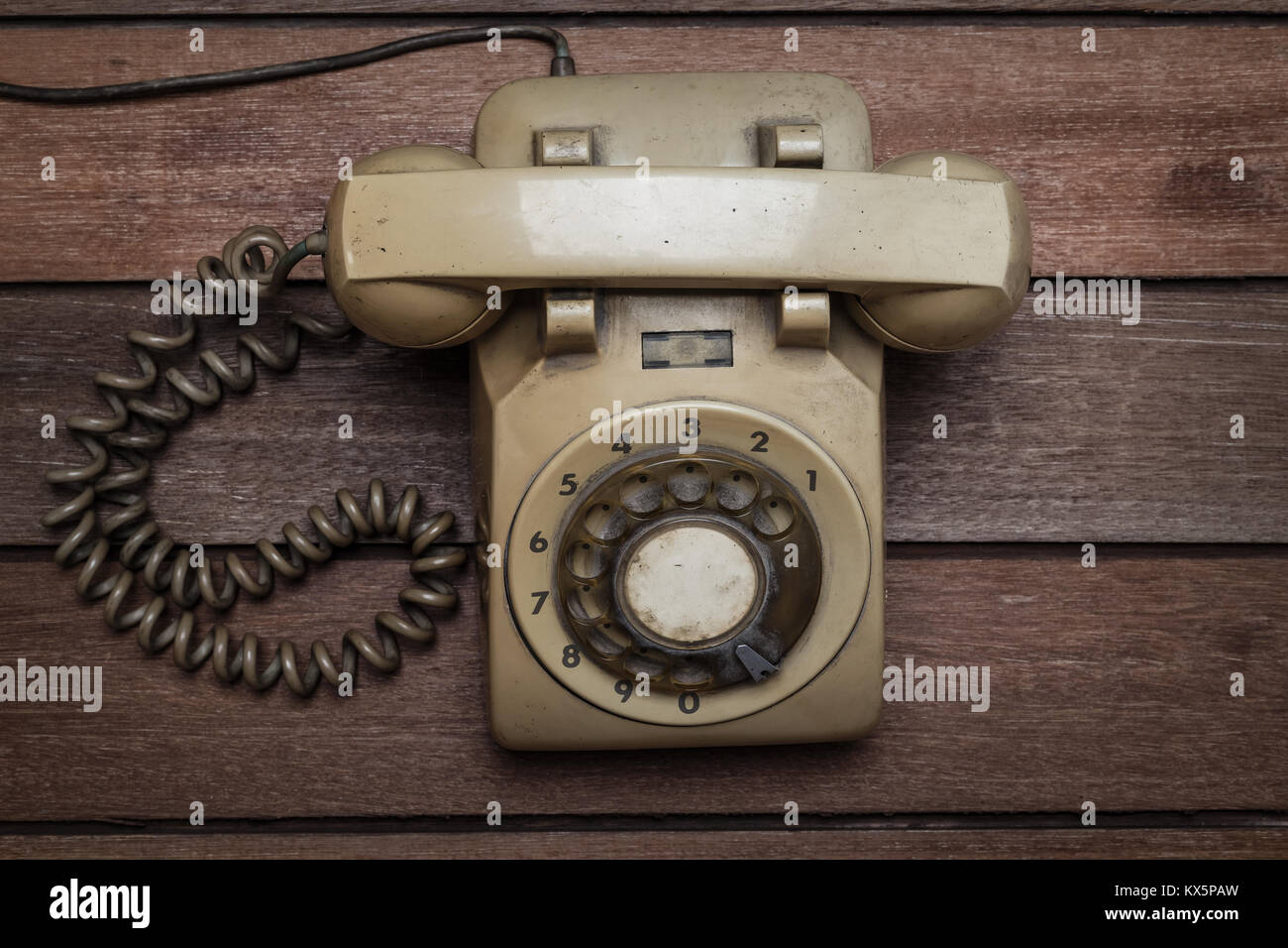 Vintage Telephone on an Old Wood Table Stock Photo - Alamy
