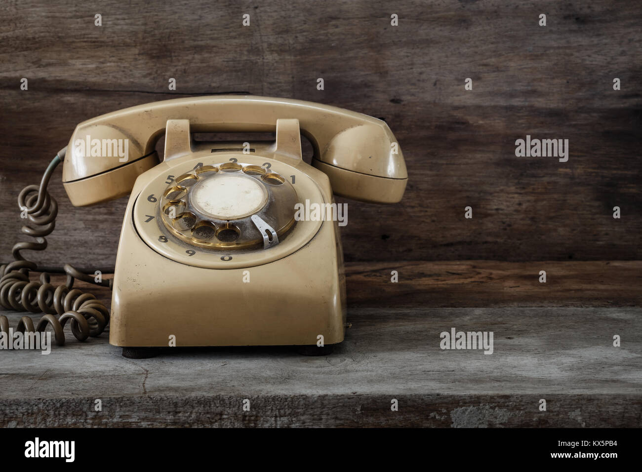 Vintage Telephone on an Old Wood Table Stock Photo - Alamy