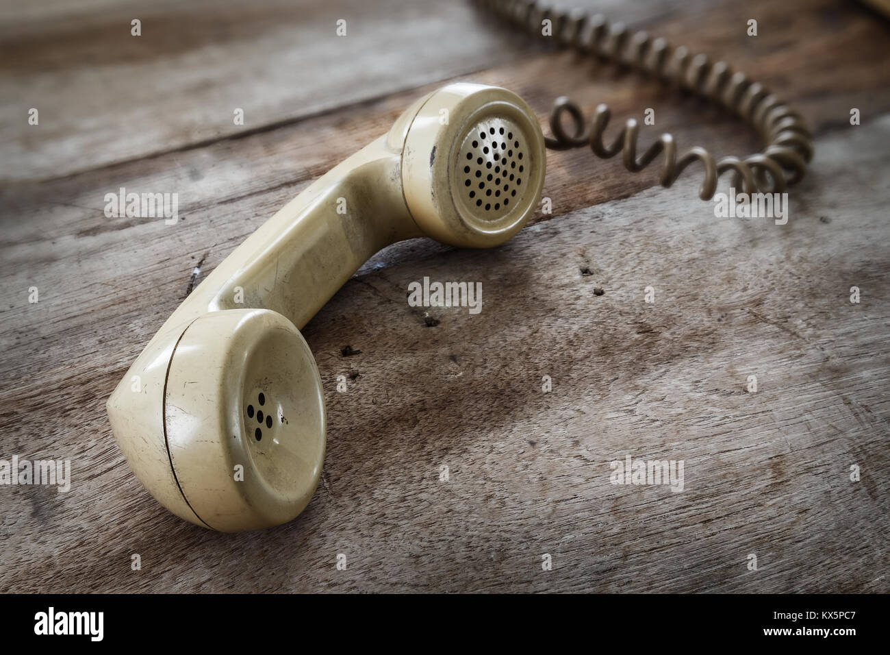 Vintage Telephone on an Old Wood Table Stock Photo - Alamy